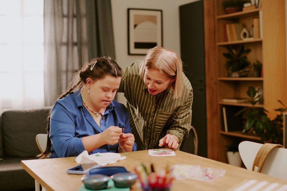 Senior maintaining independence with a caregiver nearby